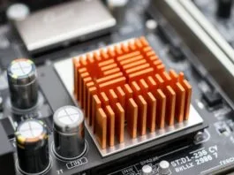 A close-up of a modern motherboard, highlighting solid capacitors and VRM heatsinks for enhanced durability and longevity.
