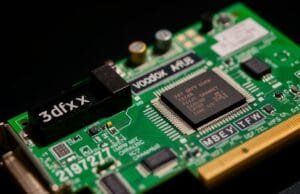 Evolution of the GPU: GPU Evolution: How a Pixel Pusher… A close-up of a vintage 3dfx Voodoo Graphics card, highlighting its distinctive green circuit board and chips, against a dark, slightly blurred background.