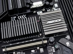ASRock X870E Taichi OCF: Unleash AM5 Overclocking Power A close-up of the ASRock X870E Taichi OCF motherboard's VRM section with large heatsinks and numerous power stages.