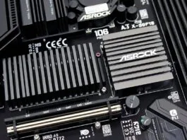 A close-up of the ASRock X870E Taichi OCF motherboard's VRM section with large heatsinks and numerous power stages.