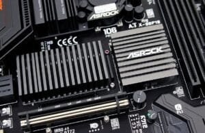 ASRock X870E Taichi OCF: Unleash AM5 Overclocking Power A close-up of the ASRock X870E Taichi OCF motherboard's VRM section with large heatsinks and numerous power stages.
