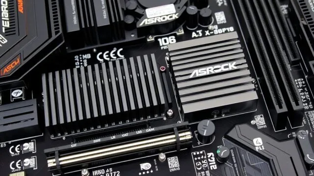 A close-up of the ASRock X870E Taichi OCF motherboard's VRM section with large heatsinks and numerous power stages.