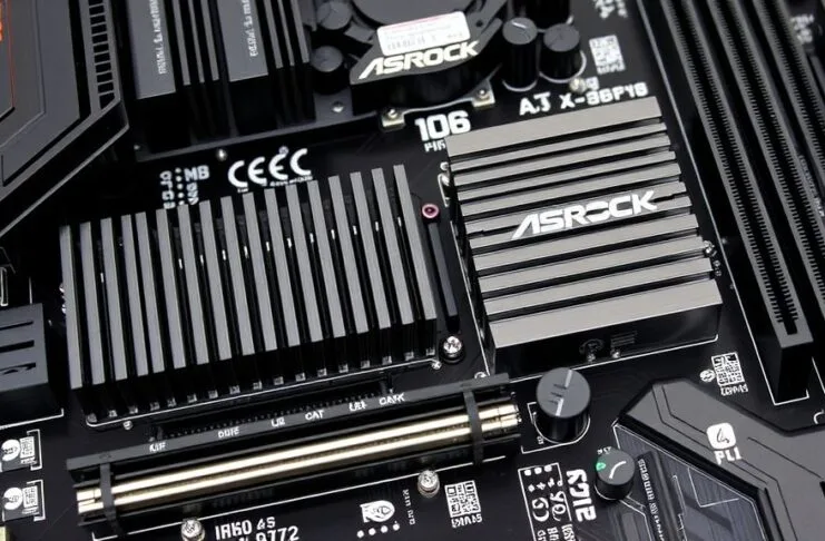 A close-up of the ASRock X870E Taichi OCF motherboard's VRM section with large heatsinks and numerous power stages.