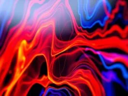 A close-up shot of an OLED TV screen displaying vibrant, high-contrast HDR content, showcasing deep blacks and bright colors.
