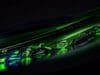 NVIDIA Blackwell GeForce RTX: Next-Gen for Every Gamer, $299 A close-up view of an NVIDIA GeForce RTX 50 Series graphics card with glowing green accents, highlighting its sleek design and advanced cooling.