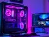 4K Gaming & Streaming Beast: Build Your No-Compromise PC A sleek, futuristic gaming PC build, showcasing RGB lighting and high-end components, with a large 4K monitor displaying an intense game scene and a second monitor showing streaming software.