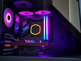 A sleek, minimalist custom PC build featuring a Mini-ITX motherboard, visible through a tempered glass side panel, highlighting efficient component placement and vibrant RGB lighting. This image represents innovative motherboard form factors.