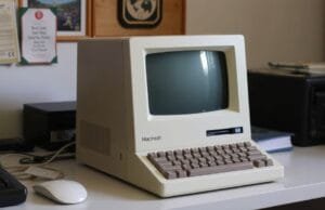 Macintosh Era: How It Changed Computing Forever Original Macintosh 128K on a desk, showcasing its compact, all-in-one design and integrated screen
