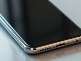 A close-up shot of a modern smartphone with a sleek, premium design, showcasing its display and thin bezels, a key visual for **interpreting flagship phone reviews**.