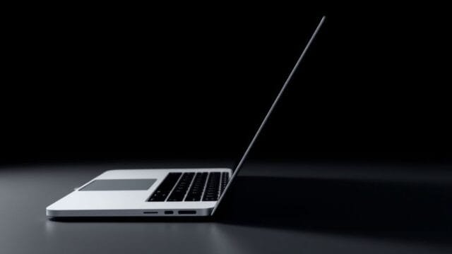 2026 MacBook Pro OLED features: Beyond Retina A side-profile view of a conceptual 2026 MacBook Pro, emphasizing its rumored ultra-thin chassis and sleek, minimalist design, hinting at key 2026 MacBook Pro OLED features.