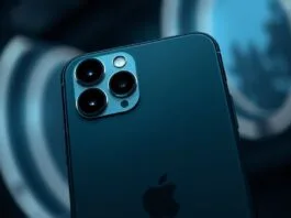 A sleek, modern iPhone 17 with its front-facing camera prominently displayed, surrounded by subtle digital light effects emanating from the camera module, illustrating the advanced iPhone 17 Center Stage Camera technology in a futuristic setting.
